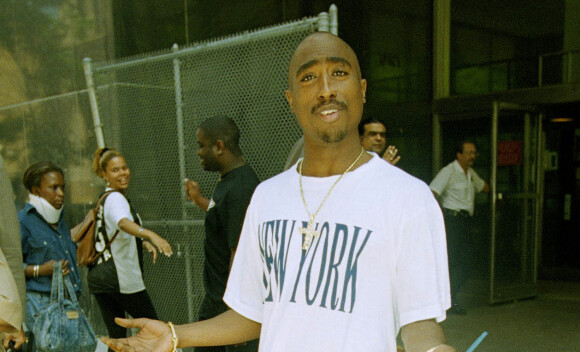 Rapper Tupac Shakur gestures as he leaves State Supreme Court in New York, July 11, 1994 after a pretrial hearing on charges of sodomy and sexual abuse stemming from an incident in a New York hotel room earlier this year. (AP Photo/Adam Nadel)